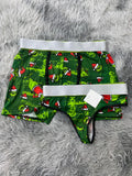 Grinch y árboles de navidad fondo verde Duo Unitalla Con Tanga