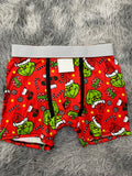 Grinch y regalos fondo rojo Boxer De Hombre unitalla